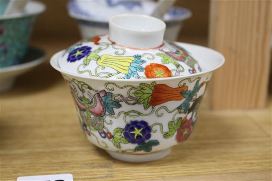 Five Chinese porcelain rice bowls, covers and stands, together with two spoons, second half 20th century, bowls 10.5cm diameter